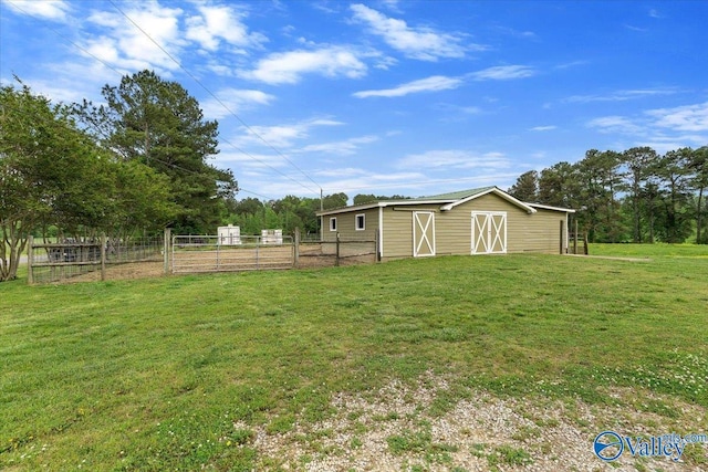 view of yard featuring fence and an outdoor structure