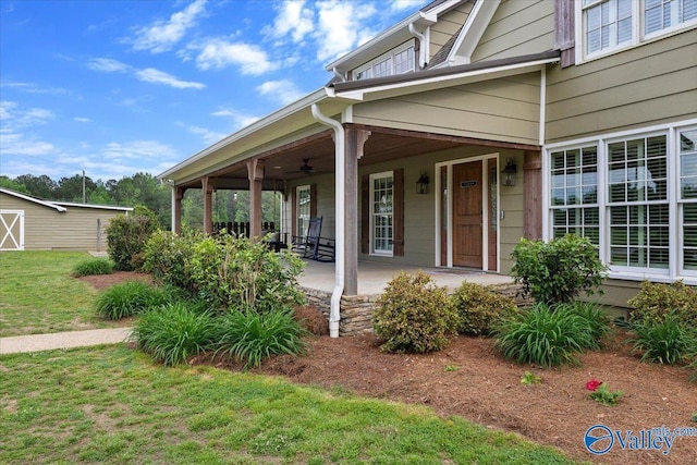 view of home's exterior with a yard and covered porch