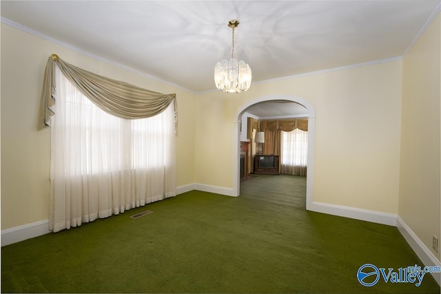 514 W St, Scottsboro, AL 35768 - carpeted empty room featuring crown molding, baseboards, visible vents, arched walkways, and an inviting chandelier