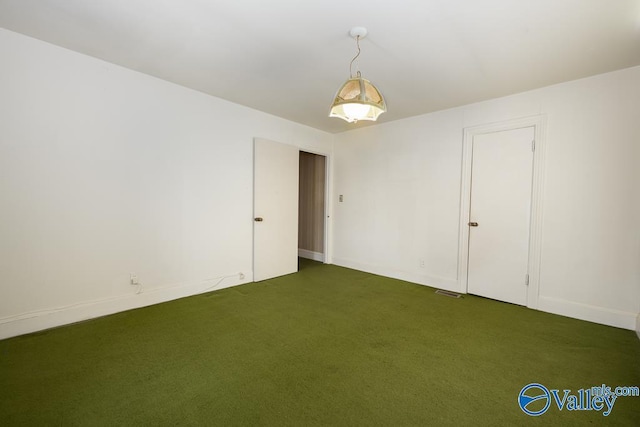 514 W St, Scottsboro, AL 35768 - empty room featuring carpet flooring and baseboards