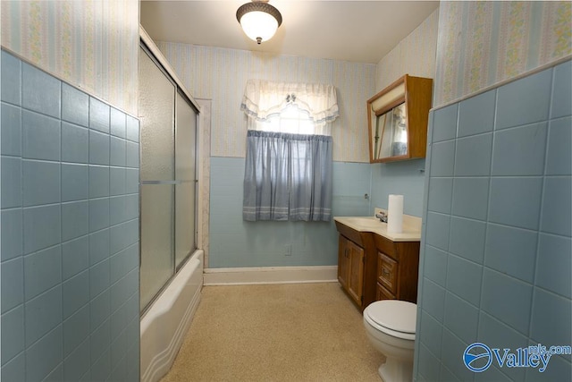 514 W St, Scottsboro, AL 35768 - full bath with vanity, tile walls, toilet, wallpapered walls, and wainscoting