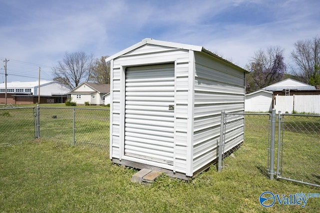514 W St, Scottsboro, AL 35768 - view of shed with a fenced backyard