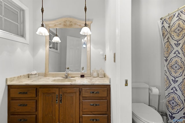 bathroom with vanity, toilet, and a shower with shower curtain