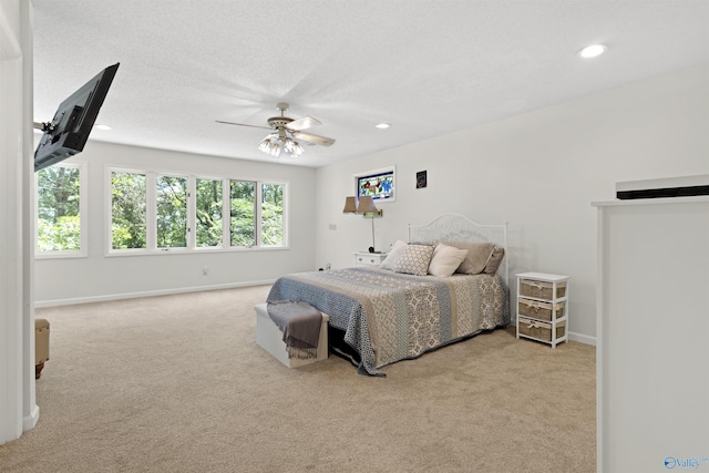 bedroom with carpet floors, recessed lighting, baseboards, and ceiling fan