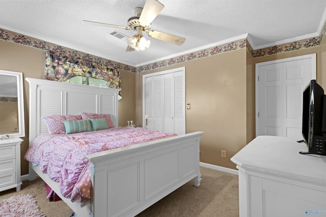 bedroom featuring light carpet, a closet, a textured ceiling, crown molding, and a ceiling fan