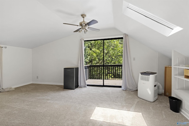 bonus room with lofted ceiling, carpet, a skylight, and a ceiling fan