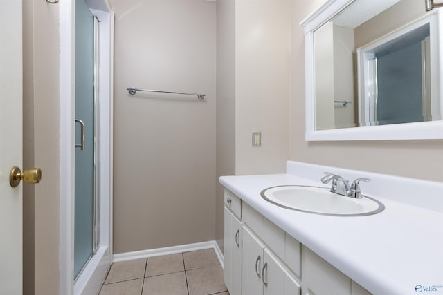 1903 Garner St, Scottsboro, AL 35769 - full bathroom with tile patterned floors, a shower stall, vanity, and baseboards