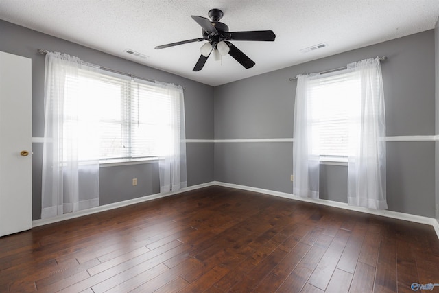 1903 Garner St, Scottsboro, AL 35769 - empty room featuring visible vents, ceiling fan, a textured ceiling, and wood finished floors