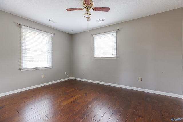 1903 Garner St, Scottsboro, AL 35769 - unfurnished room with visible vents, hardwood / wood-style floors, and a healthy amount of sunlight