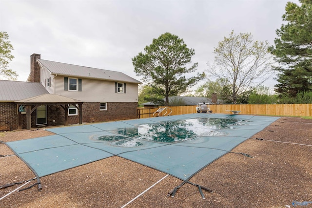 1903 Garner St, Scottsboro, AL 35769 - view of swimming pool with a patio area, a fenced backyard, a fenced in pool, and a diving board
