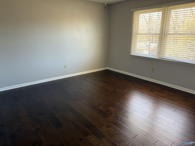 1903 Garner St, Scottsboro, AL 35769 - unfurnished room featuring dark wood-style flooring and baseboards