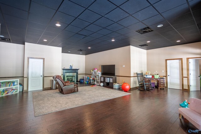 playroom featuring hardwood / wood-style floors and a paneled ceiling