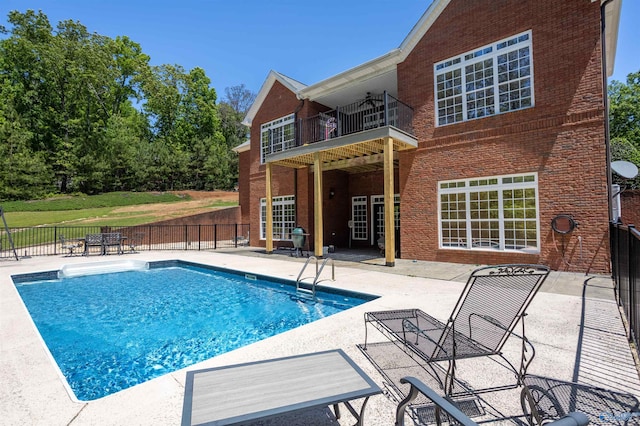 view of swimming pool with a patio