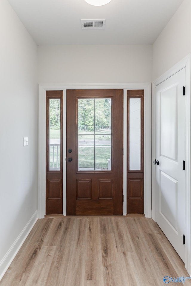 foyer with light hardwood / wood-style floors