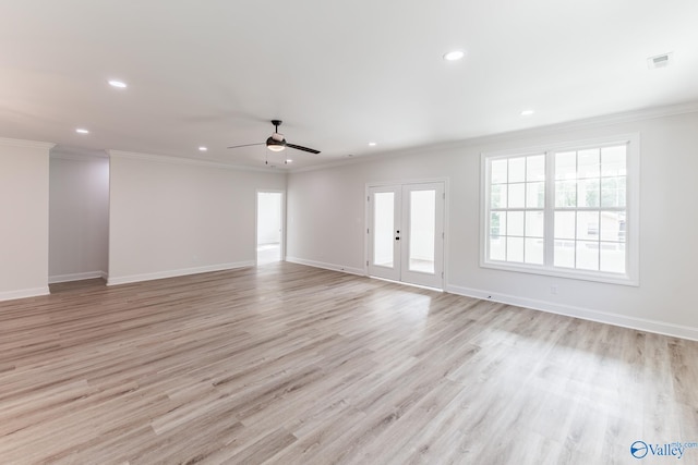 unfurnished living room featuring ornamental molding, light wood-type flooring, and ceiling fan