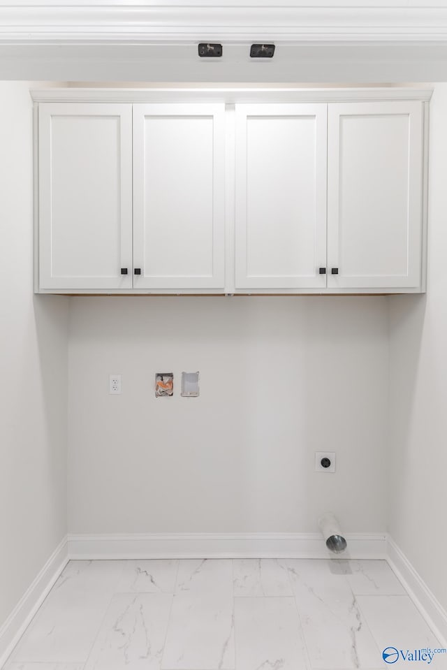 clothes washing area featuring hookup for an electric dryer, hookup for a washing machine, and cabinets