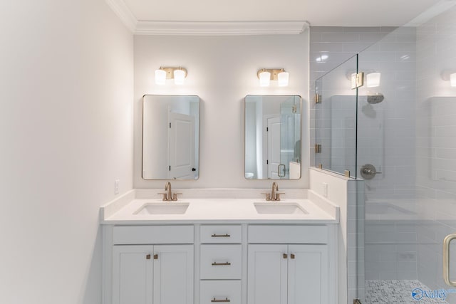 bathroom with a shower with door, crown molding, and vanity