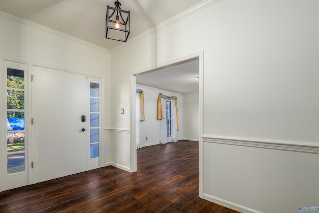 entryway featuring wood finished floors, baseboards, and ornamental molding