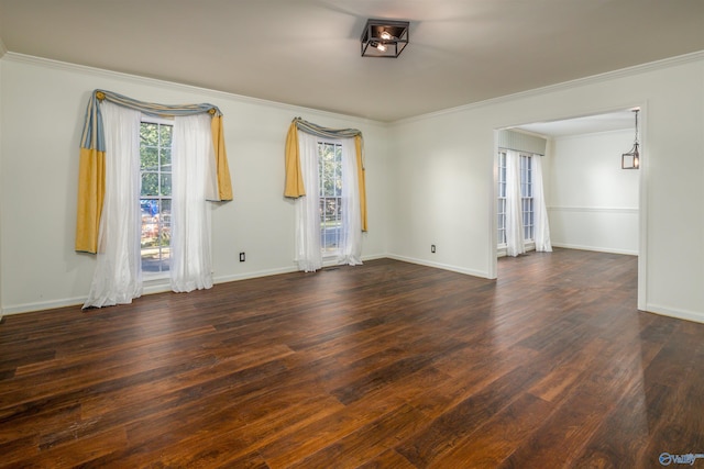 unfurnished room featuring wood finished floors and baseboards