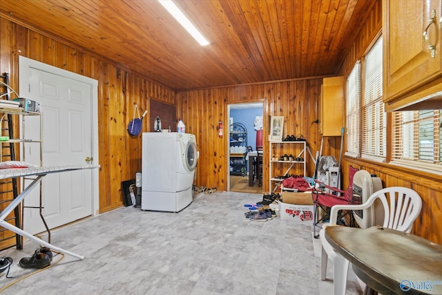 interior space featuring wooden ceiling, wooden walls, and washer / clothes dryer