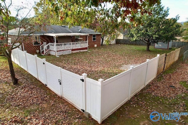 exterior space with a fenced backyard