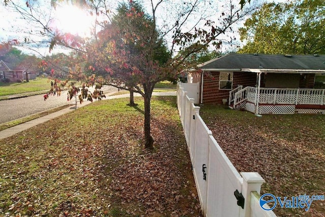 exterior space with covered porch and fence