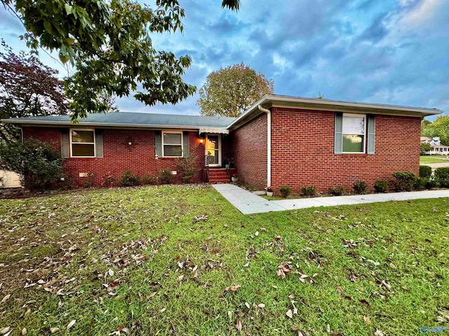 ranch-style house with a front yard