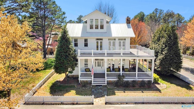 view of front of house with a porch and a balcony