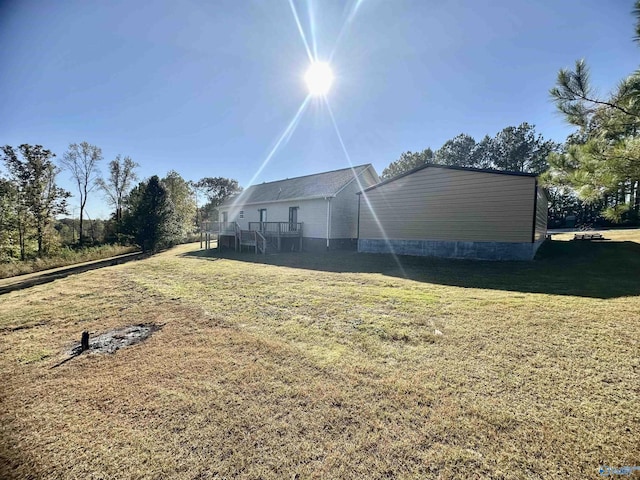 rear view of house with a yard