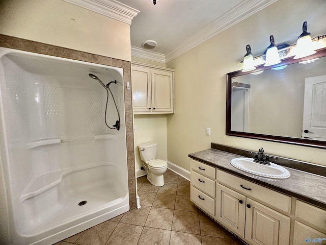 bathroom with tile patterned floors, baseboards, vanity, toilet, and ornamental molding