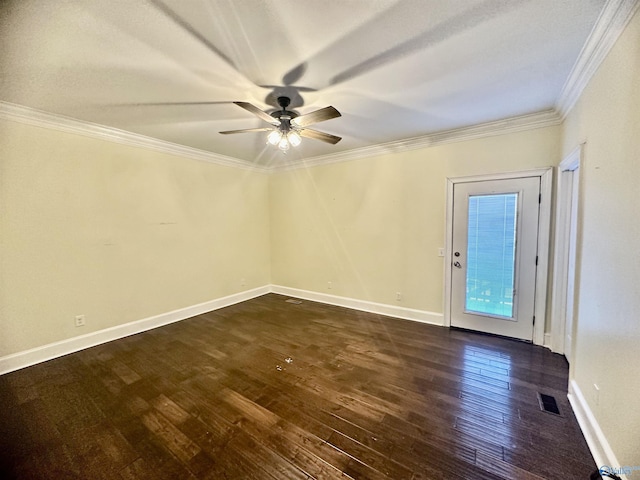 empty room featuring ceiling fan, visible vents, baseboards, dark wood-style floors, and ornamental molding