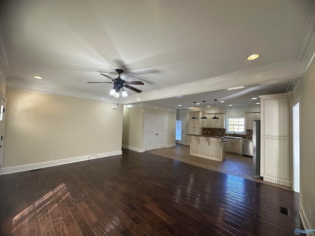 unfurnished living room featuring crown molding, sink, dark wood-type flooring, and ceiling fan