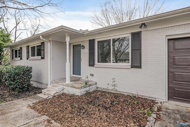 view of exterior entry featuring a garage