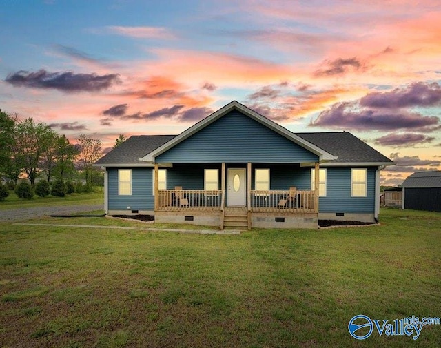 bungalow with covered porch, a front yard, and crawl space