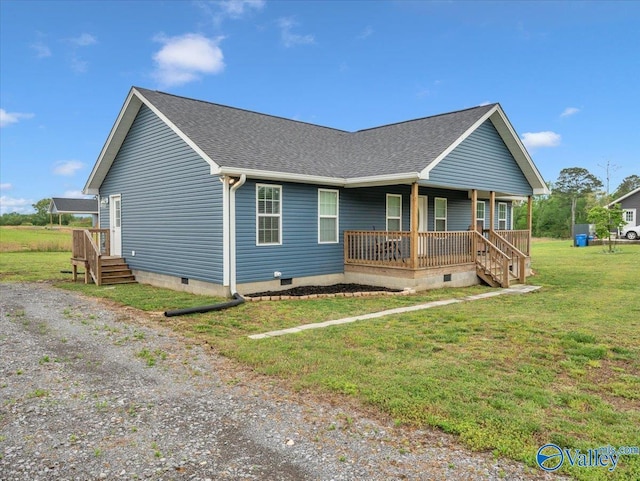view of front of house with roof with shingles, a porch, crawl space, and a front yard