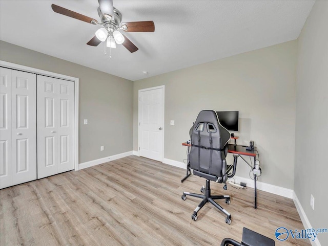 office space with ceiling fan, wood finished floors, and baseboards