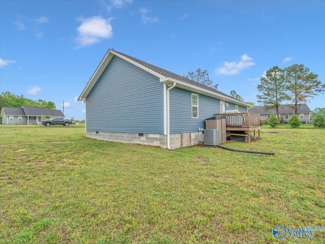 view of property exterior featuring a deck, central air condition unit, a lawn, and crawl space