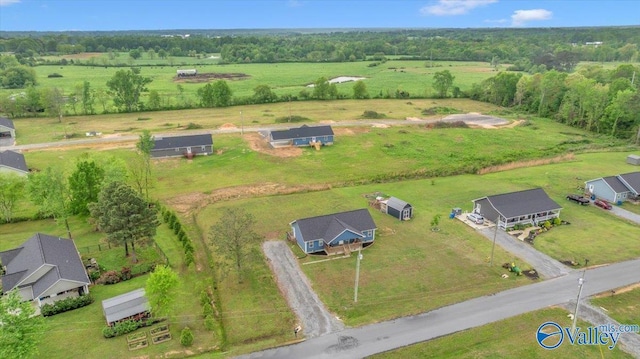birds eye view of property with a rural view