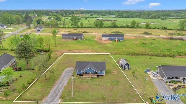 birds eye view of property featuring a rural view