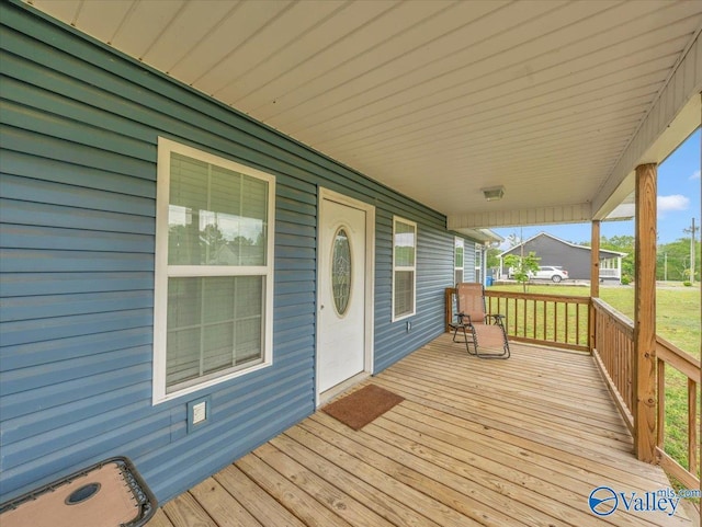 wooden terrace featuring a porch