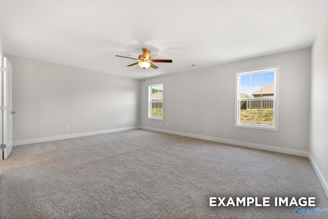 carpeted empty room with ceiling fan