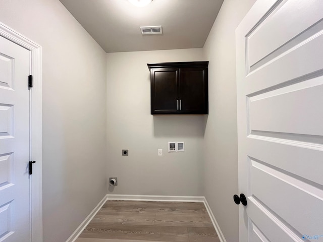 122 Parvin Way Dr, Hazel Green, AL 35750 - clothes washing area with visible vents, electric dryer hookup, baseboards, and wood finished floors