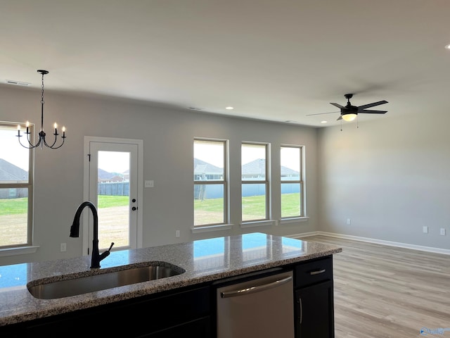 122 Parvin Way Dr, Hazel Green, AL 35750 - kitchen with stone counters, dishwasher, a sink, and a healthy amount of sunlight
