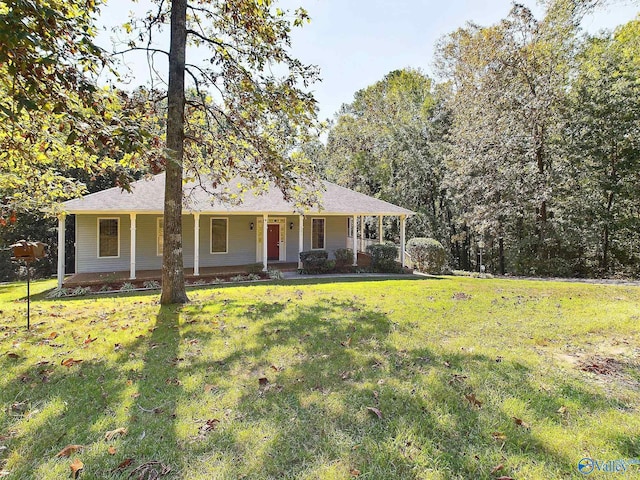 ranch-style home featuring a porch and a front yard