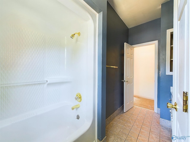 bathroom featuring tile patterned flooring and washtub / shower combination