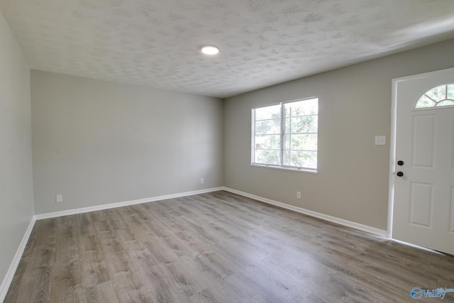 629 Dawson Ter NW, Huntsville, AL 35811 - foyer entrance with wood finished floors and a textured ceiling