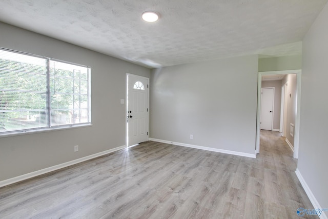 629 Dawson Ter NW, Huntsville, AL 35811 - foyer featuring light wood finished floors and a textured ceiling