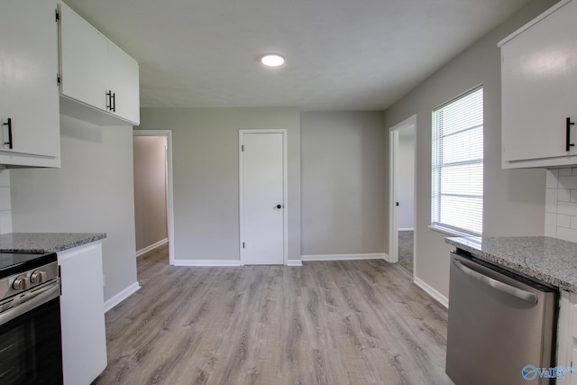 629 Dawson Ter NW, Huntsville, AL 35811 - kitchen with stainless steel appliances, light wood-style flooring, white cabinets, and light stone counters