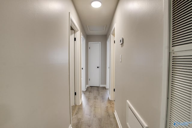 629 Dawson Ter NW, Huntsville, AL 35811 - hall featuring light wood-type flooring, a heating unit, and attic access