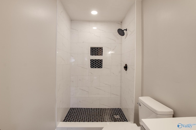 629 Dawson Ter NW, Huntsville, AL 35811 - bathroom with tiled shower, vanity, and recessed lighting